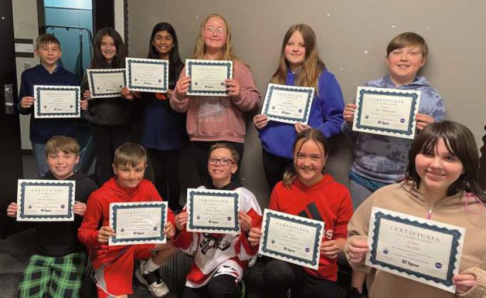 Sixth grade students at Hull Prairie Intermediate School recently received honors for helping NASA with total solar eclipse data collection. Front row, from left: Lincoln Sandwisch, Landon Knestrick, Graham Brossia, Julia Atkinson, Aly Ebert. Back row: Elias Lewis, Ryleigh Avalos, Gauri Pandav, Lily Lemon, Lucy Johnson, Devin Wladkowski. Not pictured: Lilian Barkholz.