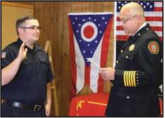 Fire Chief Tom Brice, right, swears in the newest full-time firefighter Jerod Wright. He began duty on September 9 with a starting hourly salary of $24.99.