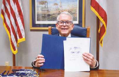 Governor Mike DeWine with signed Ohio budget bill.