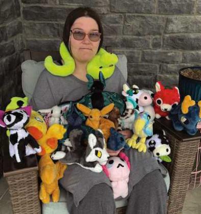 Gracie Wellington with a few of her stuffed animals.
