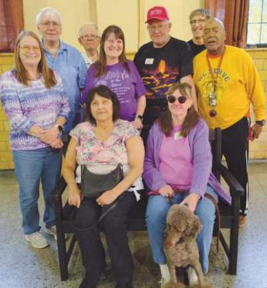 Club members on the TREX bench they earned by recycling 1,000 pounds of pastic. The bench will be installed for public use in Perrysburg.