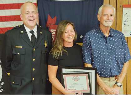 From left: Fire Chief Tom Brice, hero awardee Maggie Sutton and survivor Klaus Zoepke.