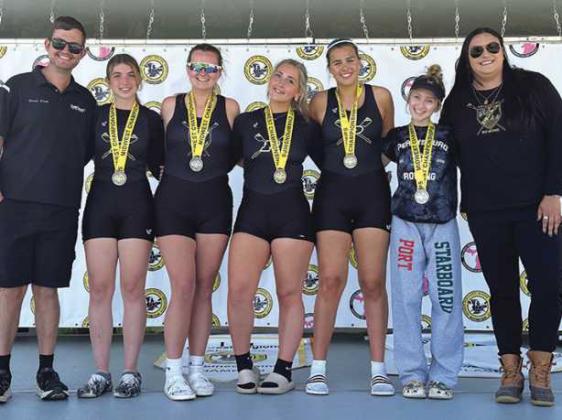 Left to right: Coach Ethan Peters, Emma Brancheau, Ava Rantanen, Tatum Takats, Katherine Cromly, Coxswain Tori Grayson and Coach Lydia Marentette.
