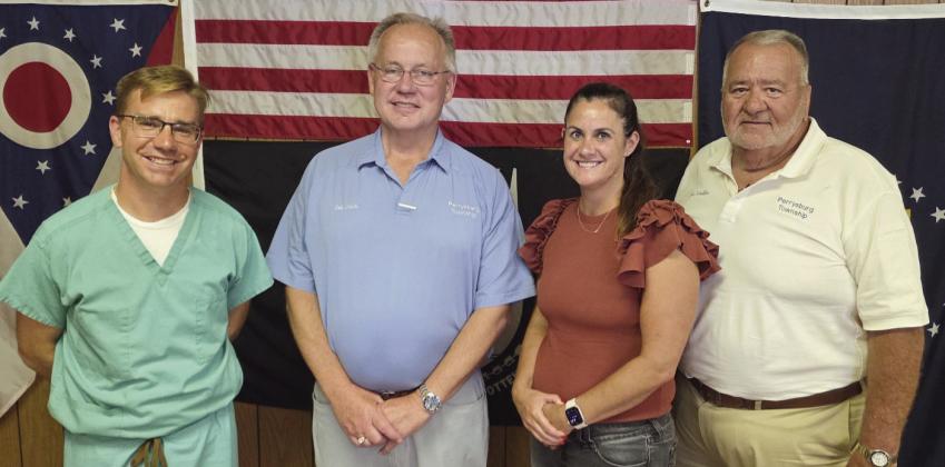 Perrysburg Township elected officials memorialize the last regular meeting of the board of trustees in the 1960s era building on Lime City Road. Future meetings will be held in the newly-constructed administration building located immediately south of the old building. From left: Trustee Jeffrey Moore, Trustee Bob Mack, Fiscal Officer Gretchen Welch and Trustee Joe Schaller.