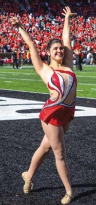 Lexi Peats twirls at Cotton Bowl