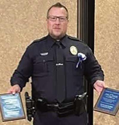 Officer John Growden receiving the Certificates of Appreciation. (Not pictured: Stephen Loar).