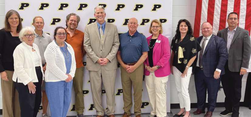 Perrysburg Board of Education members past and present who served during the tenure of Superintendent Thomas Hosler (2007-2025). Front row, from left: Gretchen Downs and Valerie Hovland. Back Row: Susan Rowland Miller, Ray Pohlman, Walt Edinger, Tom Hosler, Barry VanHoozen, Sue Larimer, Laura Meinke, Eric Benington and Chris Anderson.