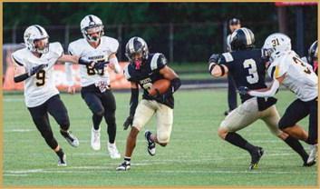 Dominick Woods finds an opening and skirts past Northview defenders.