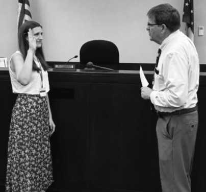 Oath of office on September 1 at Wood County Juvenile Court, from left: CASA volunteer Jessica Wente of Perrysburg with Judge David Woessner.