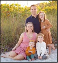 Dr. Moore with his wife, Dr. Manis, and their three children.