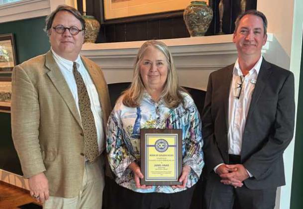 Pictured from left: David Munger, Way Library Board of Trustees; Way Library Director Janel Haas, and Way Library Assistant Director Travis McAfee.