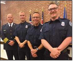 From left, Chief McCullough with Layne McNeal, Joel De-Long and Greg Robertson.