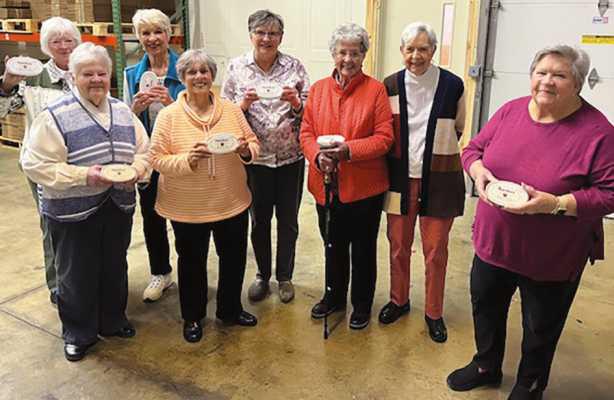 New Century Club members with their complimentary containers of Marsha’s Buckeyes.