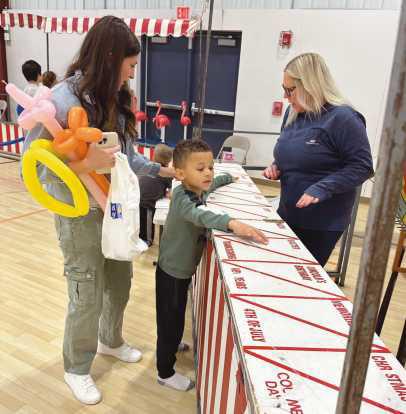 A child enjoys one of the 15 carnival games.