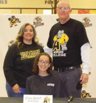 Ciara Heslet will run track for Adrian College where she plans to study interior design. Pictured with her are her parents Todd and Brenda.