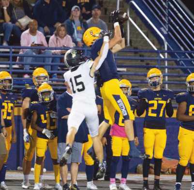 Defensive back Dylan Blubaugh is all over wide receiver Logan Frank as the Panther player leaps up for the catch.