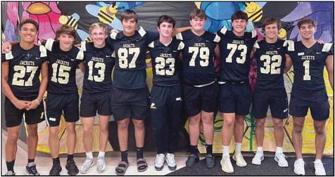 Football players visit Toth in Jacket Way program