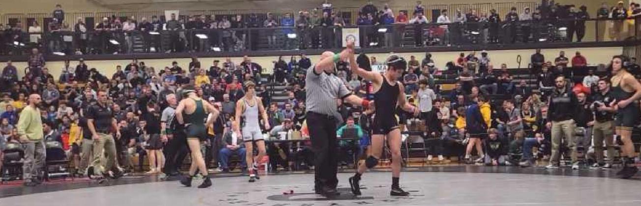 Above: Ryan Avalos gets a semifinal victory over Lakewood St. Edward.