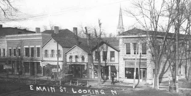 Addresses 125-131 Louisiana Avenue in 1910s. Note the barber pole and entrance to upstairs on the right.