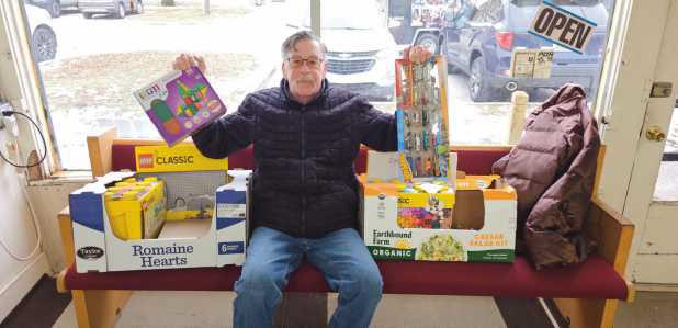 Brian Simpson with gift donations.