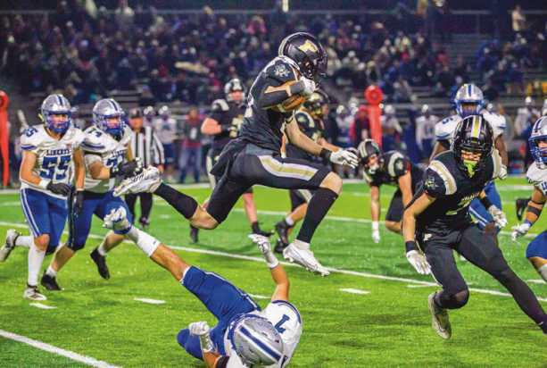 Olentangy Liberty’s strong defense kept the Yellow Jackets out of the endzone and performing aerial leaps to gain yardage.
