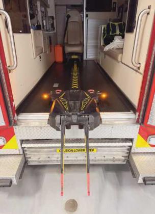 After the patient on the cot is brought over to the ambulance, the fastener system picks it up and mechanically loads them into the patient compartment.