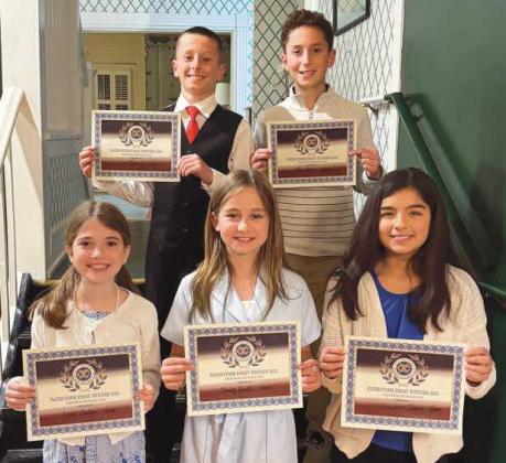 Following are the Perrysburg Exchange Club Patriotism Award winners: front, from left, Lena Coulson, Charley Smith, Charlotte Talbert; back, Levi Reddick and Ben Geha.