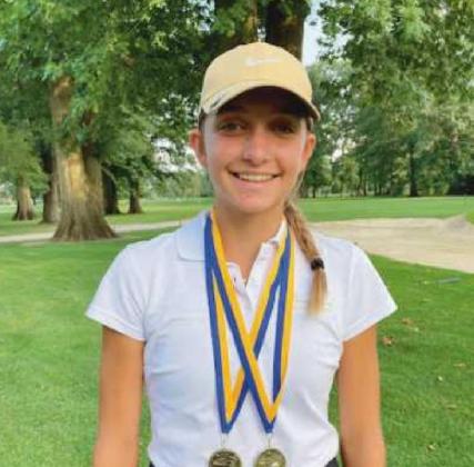 Sydney with two medals from a previous contest.