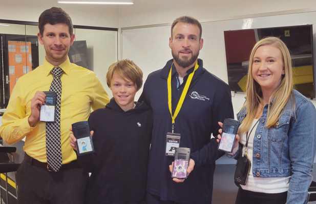 From left: Josh Roach, sixth-grade math teacher; Connor Bolles, sixth grader; Corey Bolles, owner of Bolles Professional Painting; and Genna Zachrich, sixth-grade math teacher.