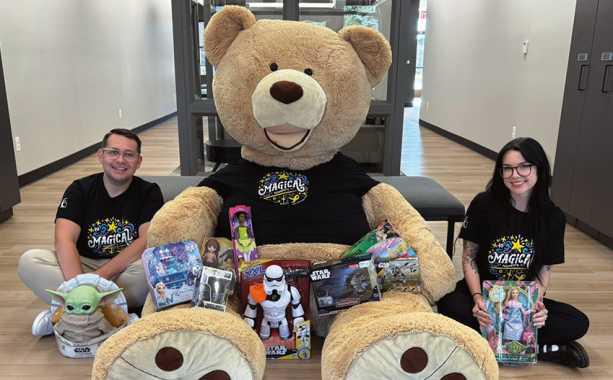 CCF employees Nick Parrino and Nicolette DeRespino pose with Freddy the Teddy and toy donations. Photo taken by Grace Alaska.