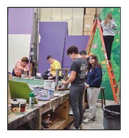 The set and props crew prepares for the show.