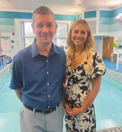 Perrysburg Rotarian Mike McGivern and Shannon Bova, Sunshine Communities chief philanthropy officer, in front of the facilities’ therapeutic pool.