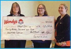 Perrysburg Wendy’s presents check to Adopt America Network