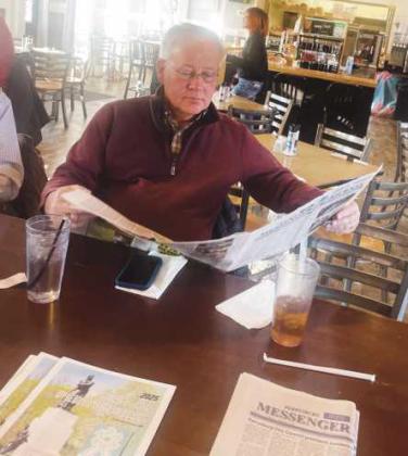 Perrysburg Township Trustee Bob Mack catches up on his reading at February’s Coffee with the Paper.