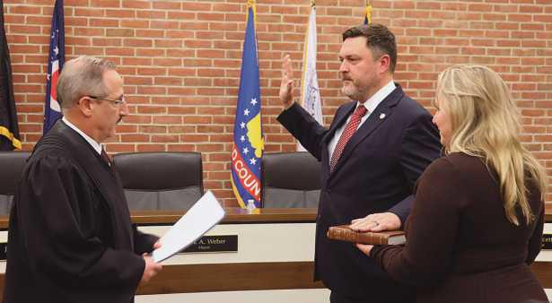 Judge Aram Ohanian swore in returning council member Kevin Fuller.