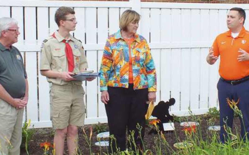 State Representative Haraz Ghanbari addresses, from left, Perrysburg city councilman Tim McCarthy, Eagle Scout David Lenz and Wood County Commissioner Doris Herringshaw.