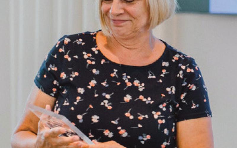 Karen Bade accepts her award