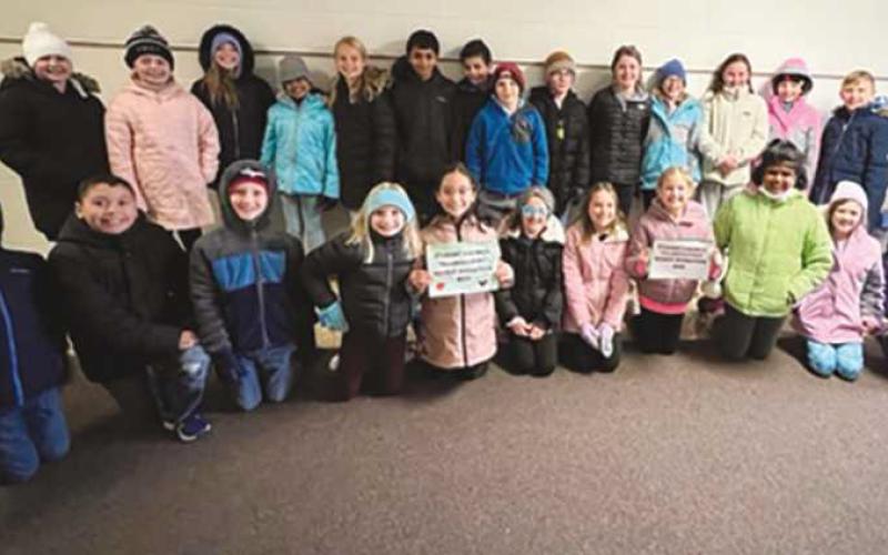 Woodland Elementary School student council partnered with the Perrysburg Schools social work department and Perrysburg Heights Community Center and collected enough food to feed 21 families for Thanksgiving.