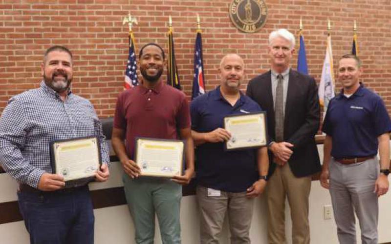 Above from left: Joe Hollon, electrician; Mark Easterling, deputy director of planning and zoning, Brian Homer, superintendent of field operations, Mayor Tom Mackin and City Administrator Joe Fawcett.