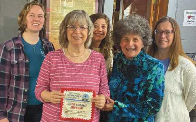 Welch Publishing Company staff with their contribution to the fiber arts project.