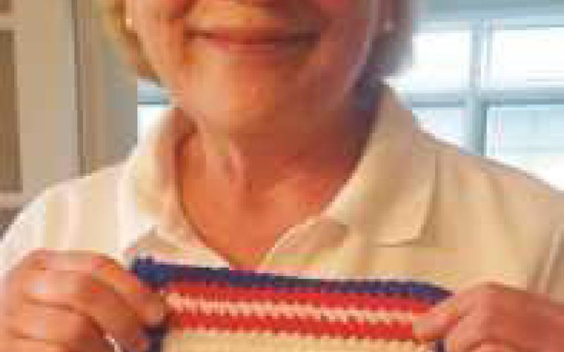 Perrysburg resident Tania Young holds the square she made.