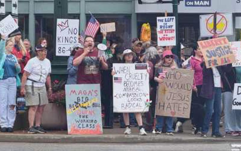 Protesters gathered at the corner of Wooster and Main streets.