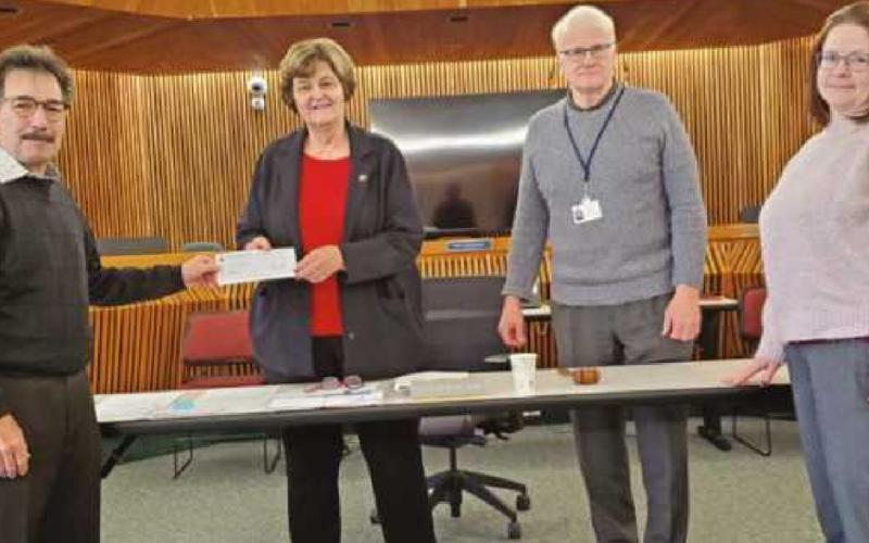 Wood County commissioners present check for Big Fix low-cost spay program