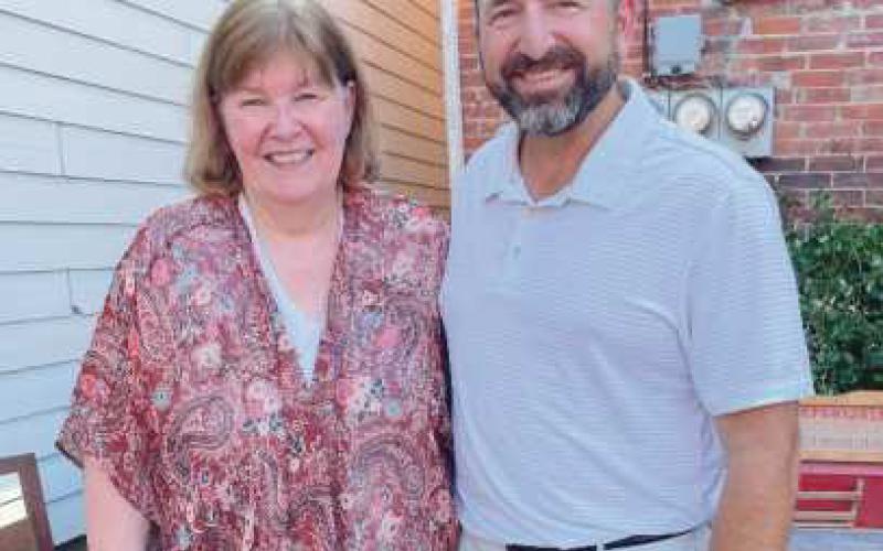 Debra Kemp, speech and debate team head coach, and Rick Rettig, former head coach and current parent coach.