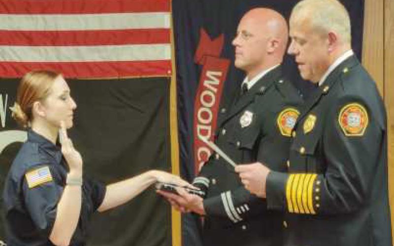 From left: New hire firefighter/paramedic Kendall Linnenkugel, Captain Michael Hampton III and Fire Chief Tom Brice.