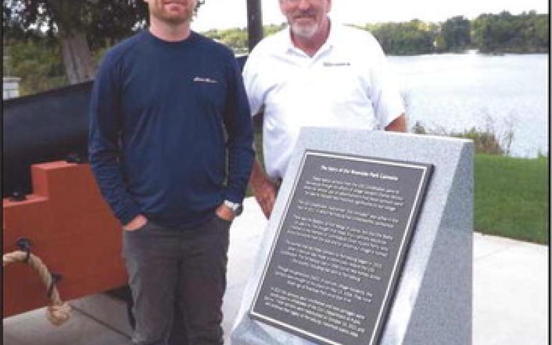 On September 18, a new podium and historical plaque were placed for the Riverside Park cannons. A formal dedication will take place at a future date. Perrysburg City workers Brody Walters and Greg Kuhr are pictured above.