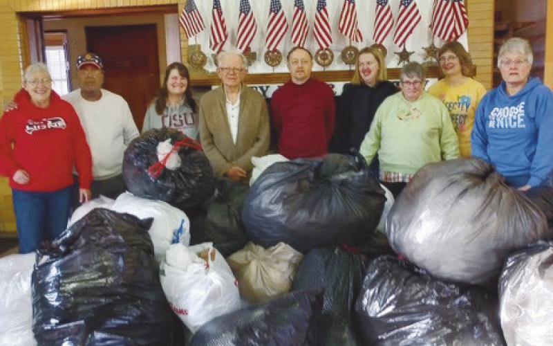 In January, the Perrysburg Lions Club members, along with Maumee United Methodist Church Awesome God class participants and leaders, pictured at left, gathered to sort and recycle plastic. At right, club