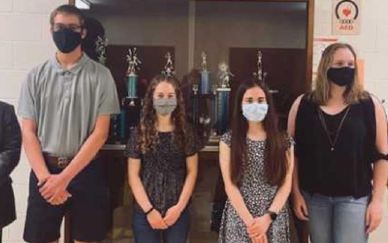 From left, Mr. Benington with National Merit finalists Connor Haar, Megan Hohman, Leah DiRubio and Hope Neal and Ms. Larimer.