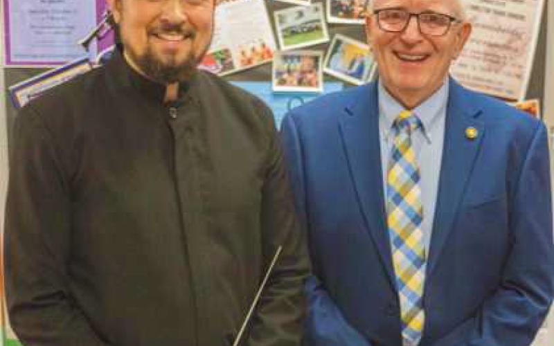 Conductor Travis Jürgens with City of Perrysburg Mayor Mark Weber.