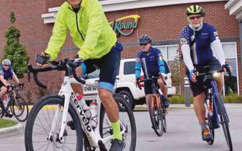 The bicyclists leave the Holiday Inn on Carronade Drive heading toward their next overnight stop in Akron.